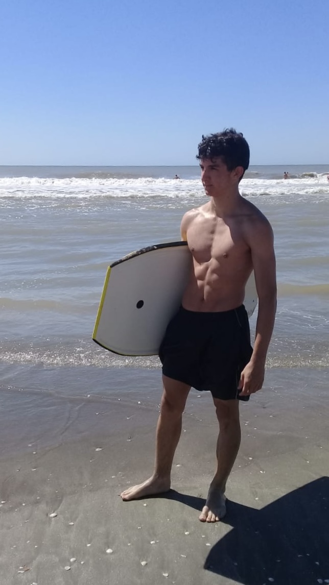 Strong and muscular on the beach